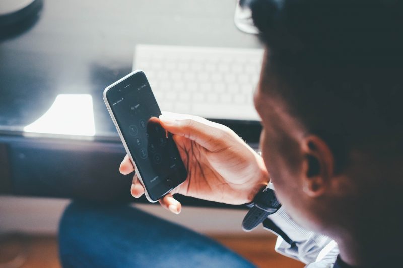 greenloopsolutions - Picture of a persons holding a smart phone